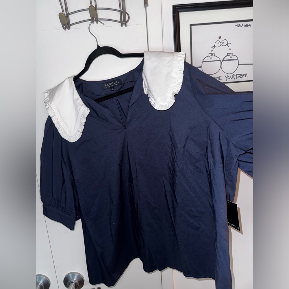 Navy blue shirt with white ruffle collar